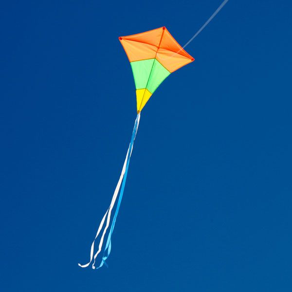 Australian made diamond tricolour single string kite flying in the distance to show long tails