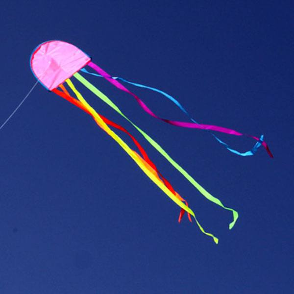 Jellyfish kite flying against blue sky