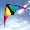 black and rainbow Stinger stunt kite for 8 to 12 year olds against a lightly cloudy sky