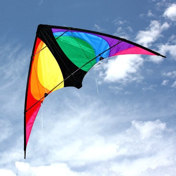 black and rainbow Stinger stunt kite for 8 to 12 year olds against a lightly cloudy sky