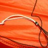 bridle string against orange sail cloth on dual control Stinger kite