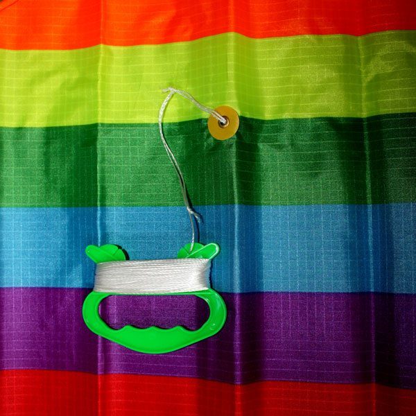 close up of Rainbow Diamond kids kite showing string and bridle point