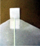 white tab stuck to kite sail