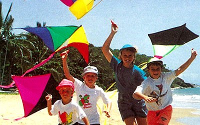 kids running and holding kites