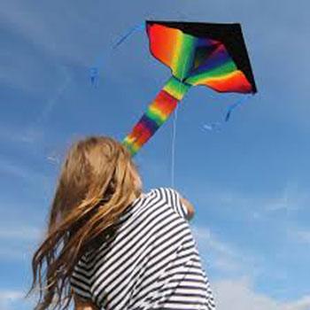 Young girl launching a single string childrens delta kite