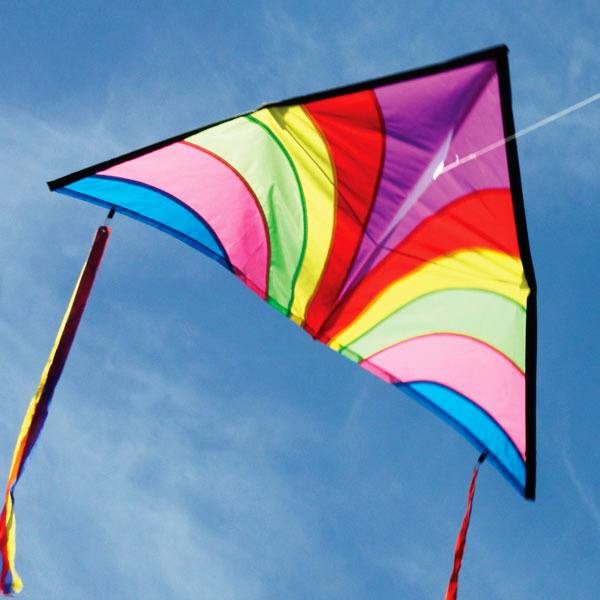 Brightly coloured delta shape kite in a blue sky