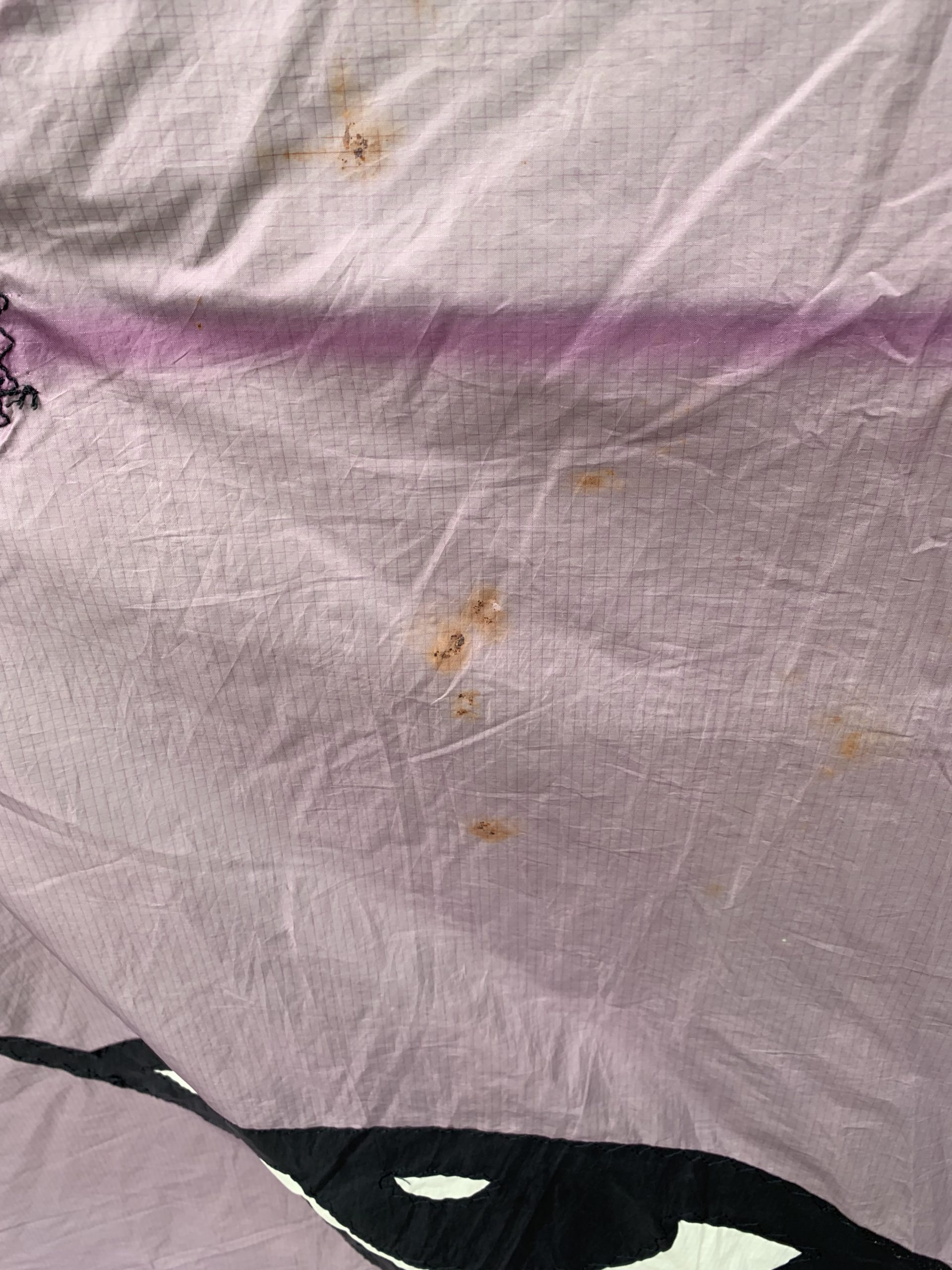 rust stain on purple kite cloth