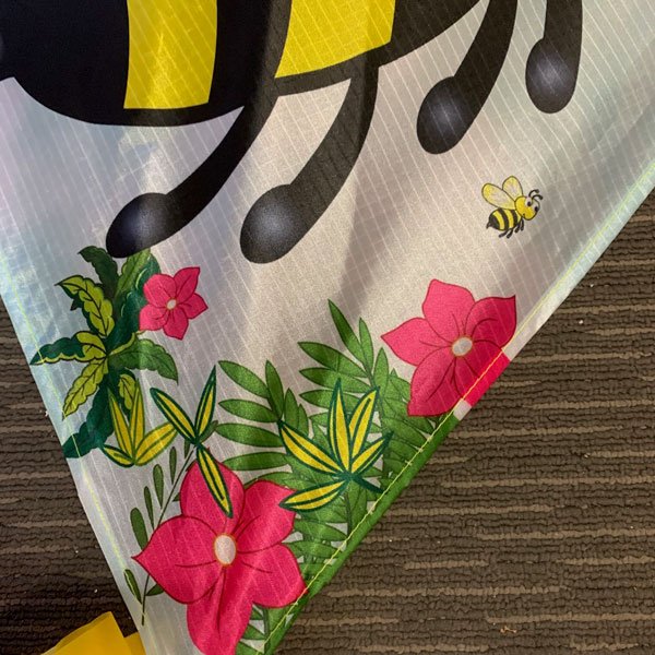 Pink flowers and green leaves printed on bumble bee diamond kite design