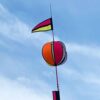 Spinning ball and flag on top of 3.6m feather pole