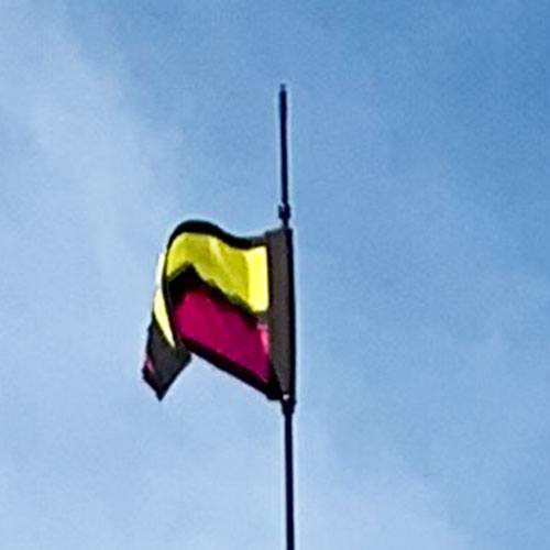 flag on top of licorice banner