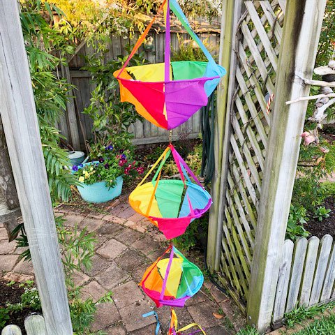 jumbo spinnie basket set hanging on a garden trellis