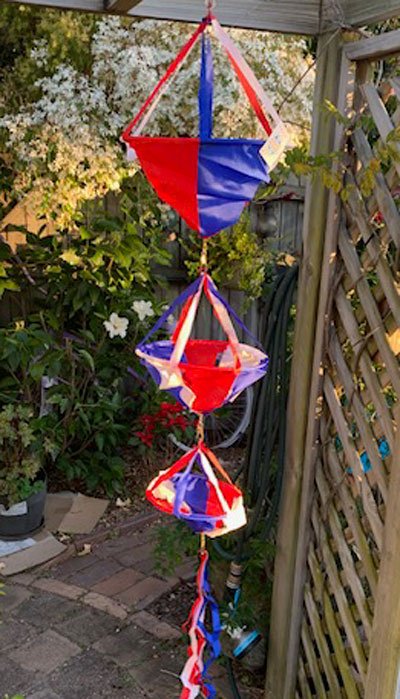 spinning baskets hanging in a pergola