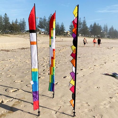 3 different feather designs on the beach