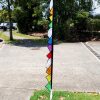 rainbow coloured carousel feather in the garden