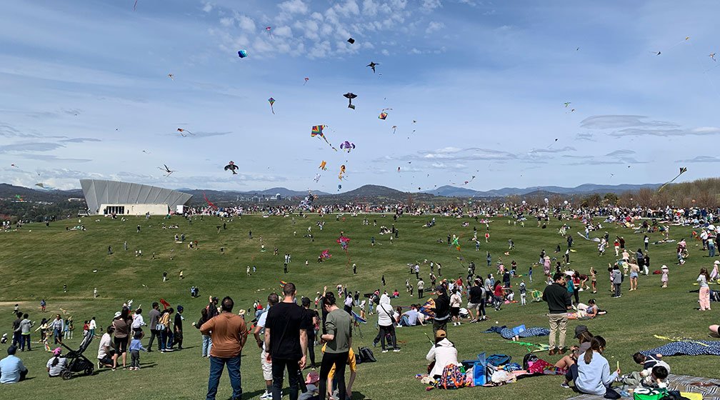 crowd watching big kites at canberra kite festival