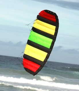 Addict adults foil kite at the beach