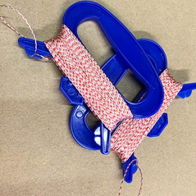 50 pound braided dacron kite line wound on to a blue plastic handle