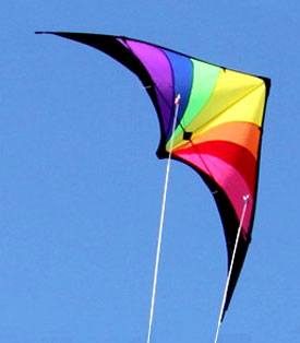 Prism dual control stunt kite flying against a clear blue sky