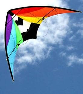1.5 Stuntmaster dual control stunt kite flying against fluffy clouds