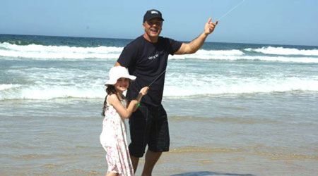 Where-To-Fly-Kites- dad and daughter flying the kite they made at a kite making workshop